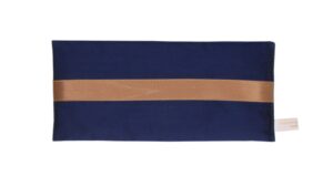 Navy silk eye pillow with honey-coloured band on a white background