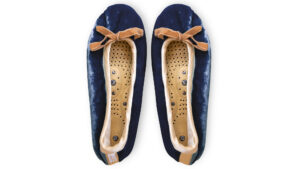 Navy silk velvet massaging slippers with honey trim and removable insoles on a white background