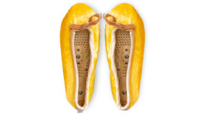 Sundrop silk velvet massaging slippers with honey trim and removable insoles on a white background
