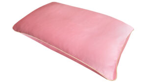 Rose pink silk pillowcase with honey-coloured piping on a white background