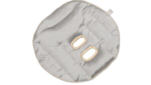 Silver grey silk face pillow with oval breathing openings and honey-coloured trim