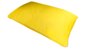 Sundrop yellow silk pillowcase with honey-coloured piping on a white background