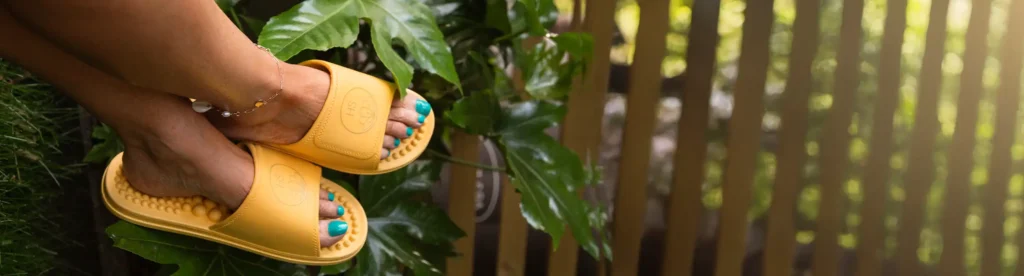 Honey Slider Sandals in a Garden Setting | Holistic Silk