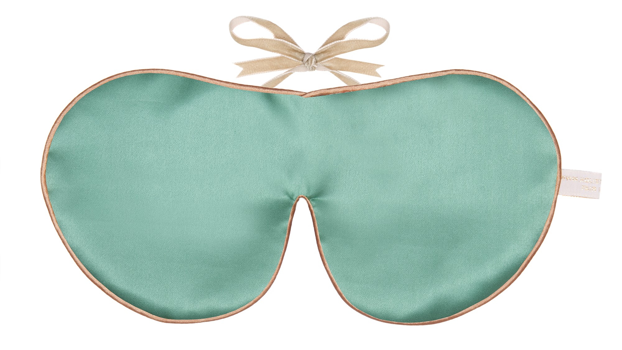 Jade silk sleep mask with honey‑coloured piping and silk ribbon tie, shown flat on a white background.