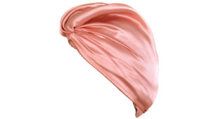 Rose pink silk hair wrap with a front twist and soft, flowing folds.
