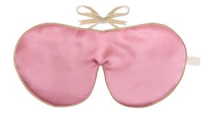 Rose silk sleep mask with honey‑coloured piping and silk ribbon tie, shown flat on a white background.